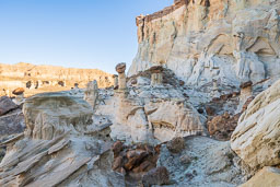 multiple-hoodoos-strange-rock-field-sandstone-wall-shadow.jpg