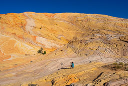 Yellow-Rock-Woman-Crouching-Taking-Photo.jpg